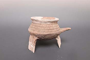 Neolithic pottery tripod with handle